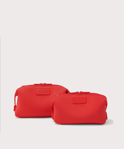 Dagne Dover Small and Large Hunter Toiletry Bags in a fiery, saturated red leaning toward orange.