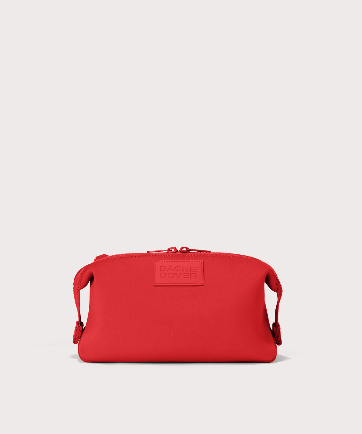 Dagne Dover Large Hunter Toiletry Bag in a fiery, saturated red leaning toward orange.