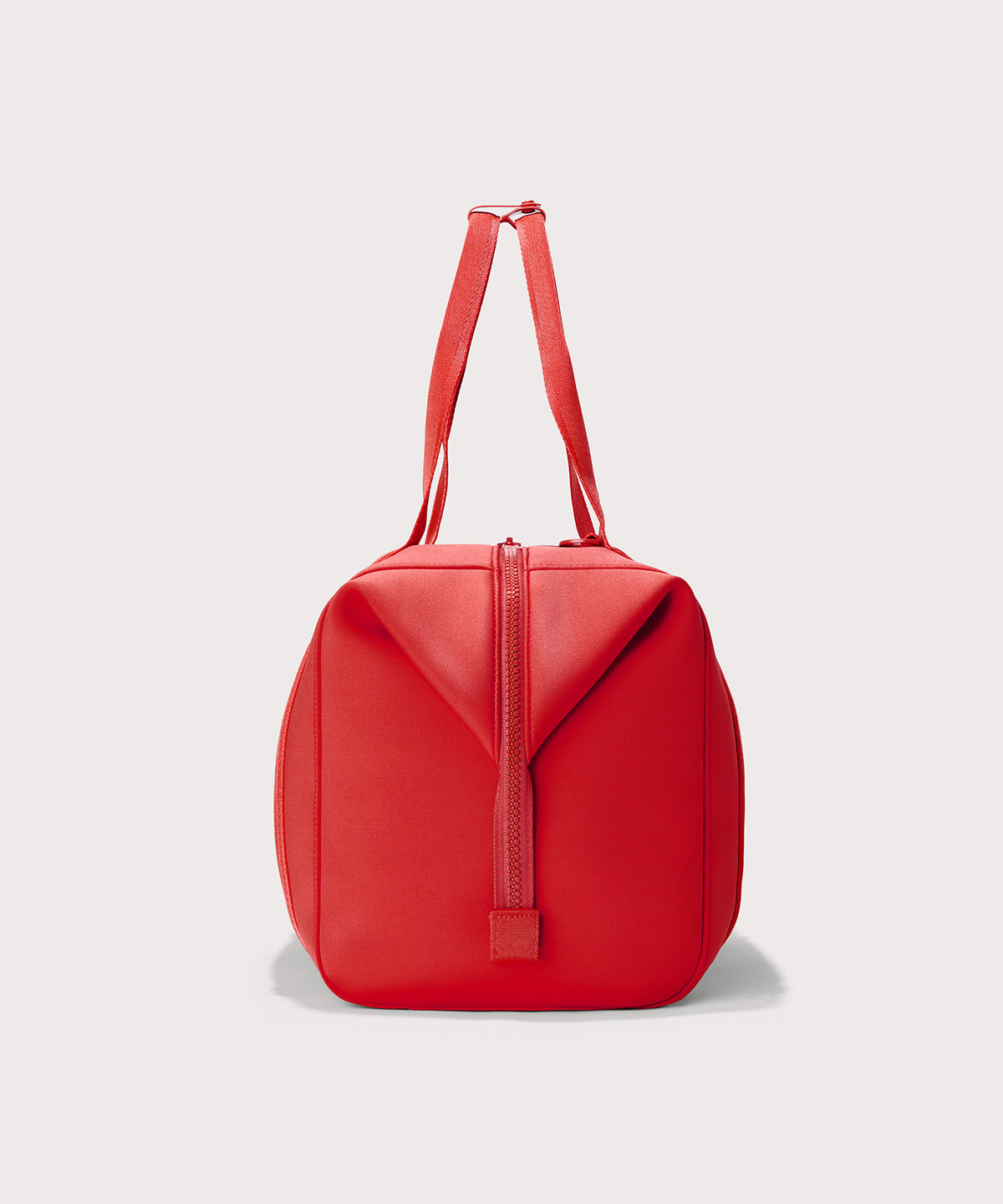 Dagne Dover Extra Large Landon Carryall in a fiery, saturated red leaning toward orange seen from the side.