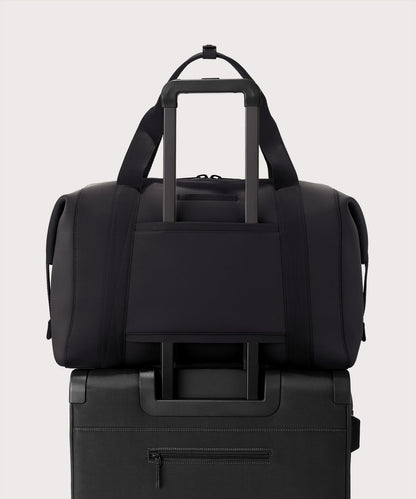 Extra large Landon Carryall in dark green displaying luggage sleeve