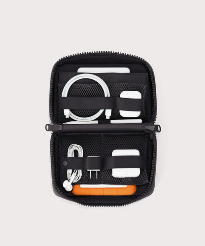 hover - Dagne Dover large Arlo Tech Organizer in black unzipped, revealing the interior elastic loops and airmesh pockets.
